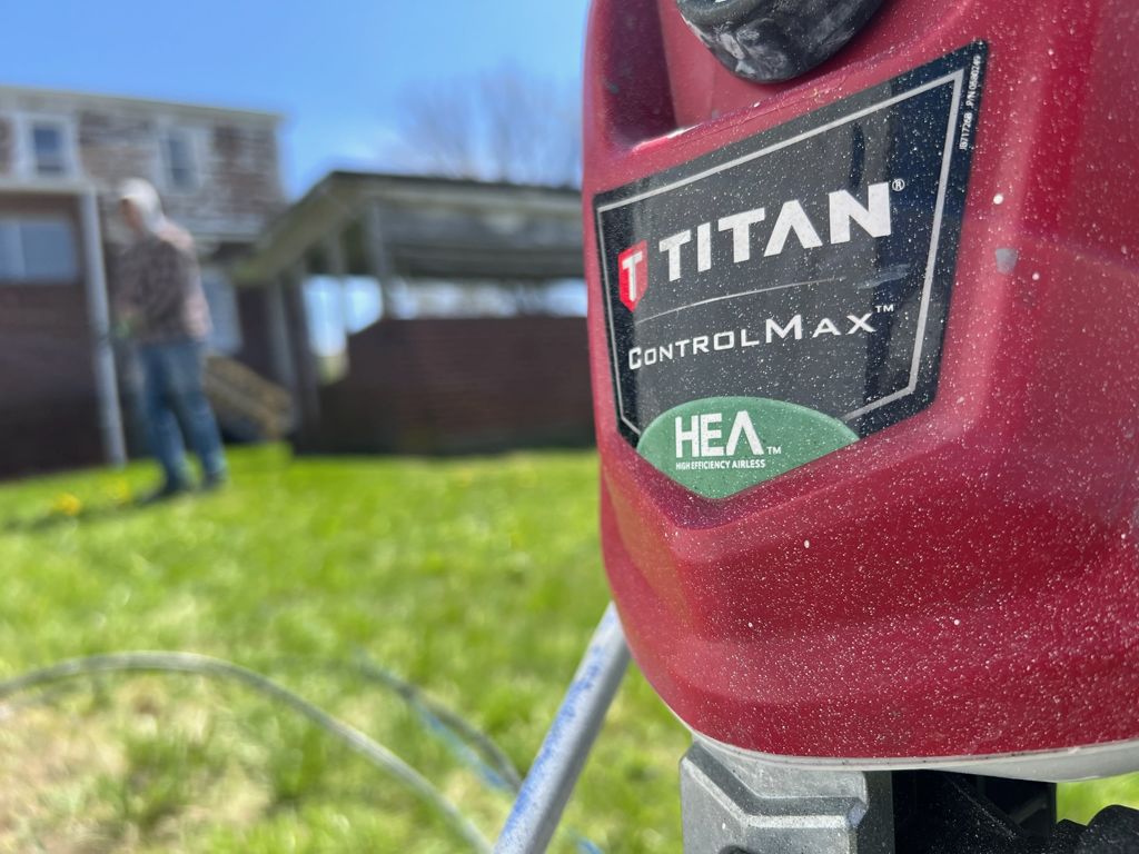Airless paint sprayer used on an exterior job