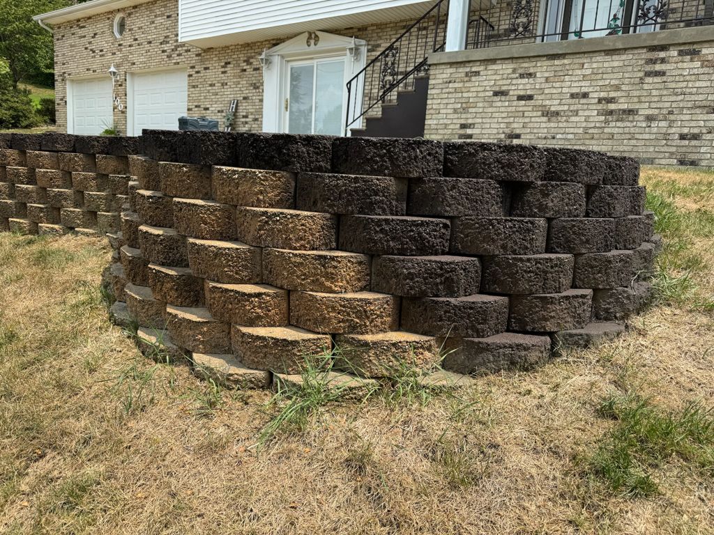 Exterior project with a stone retaining wall